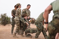 U.S. Army Sgt. Anna Arthur, assigned to the 409th Medical Company (Area Support), 330th Medical Brigade, a U.S. Army Reserve unit assigned to the 807th Medical Command and U.S. Army Sgt. 1st Class Nathan Price, assigned to the 945th Medical Detachment (Forward Resuscitative Surgical Detachment), 330th Medical Brigade, a U.S. Army Reserve unit assigned to the 807th Medical Command, assist Dutch medical personnel in relocating a simulated casualty during a multinational mass casualty training event at Centre d’Entraînement Tactique 2 (CET2) in Dodji, Senegal, May 12, 2025. The exercise, part of African Lion 2025 (AL25), brought together medics from the Armed Forces of Senegal, the Royal Netherlands Army, and the U.S. military to enhance emergency response coordination and reinforce interoperability among partner forces. AL25, the largest annual military exercise in Africa, brings together over 50 nations, including seven NATO allies and 10,000 troops to conduct realistic, dynamic and collaborative training in an austere environment that intersects multiple geographic and functional combatant commands. Led by U.S. Army Southern European Task Force, Africa (SETAF-AF) on behalf of U.S. Africa Command, AL25 takes place from April 14 to May 23, 2025, across Ghana, Morocco, Senegal, and Tunisia. This large-scale exercise will enhance our ability to work together in complex, multi-domain operations—preparing forces to deploy, fight and win.