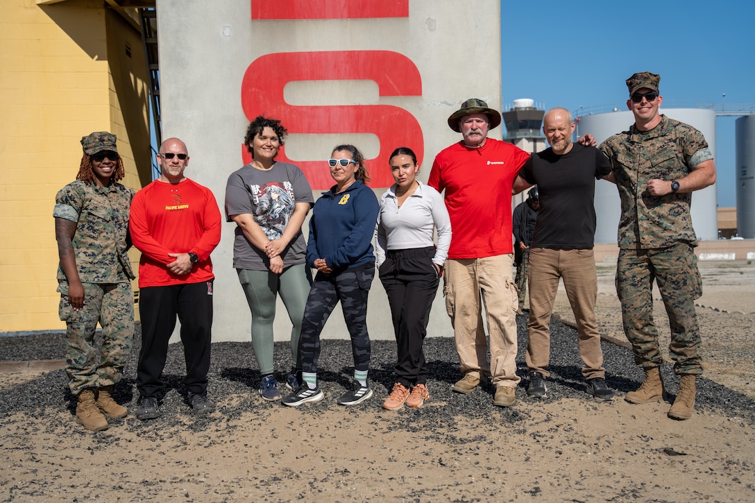 U.S. Marines and educators with Recruiting Station Los Angeles, 12th Marine Corps District, pose for a group photograph during an Educators’ Workshop event at Marine Corps Recruit Depot San Diego in San Diego, May 8, 2025. The Educators Workshop program provides selected educators and influential community members with an experiential opportunity to see how the Marine Corps transforms young men and women into Marines. The workshop also provides attendees with current information regarding Marine Corps training practices, military job skills, service opportunities, military lifestyle, and educational benefits available to Marines. (U.S. Marine Corps photo by Lance Cpl. Avery Wayland)