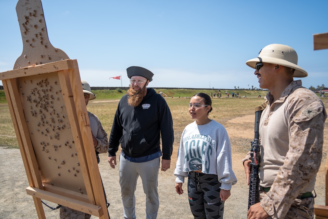 Educators with 12th Marine Corps District analyze their targets after shooting an M16A4 service rifle during an Educators’ Workshop event at Marine Corps Base Camp Pendleton in Oceanside, California, May 7, 2025. The Educators Workshop program provides selected educators and influential community members with an experiential opportunity to see how the Marine Corps transforms young men and women into Marines. The workshop also provides attendees with current information regarding Marine Corps training practices, military job skills, service opportunities, military lifestyle, and educational benefits available to Marines. (U.S. Marine Corps photo by Lance Cpl. Avery Wayland)