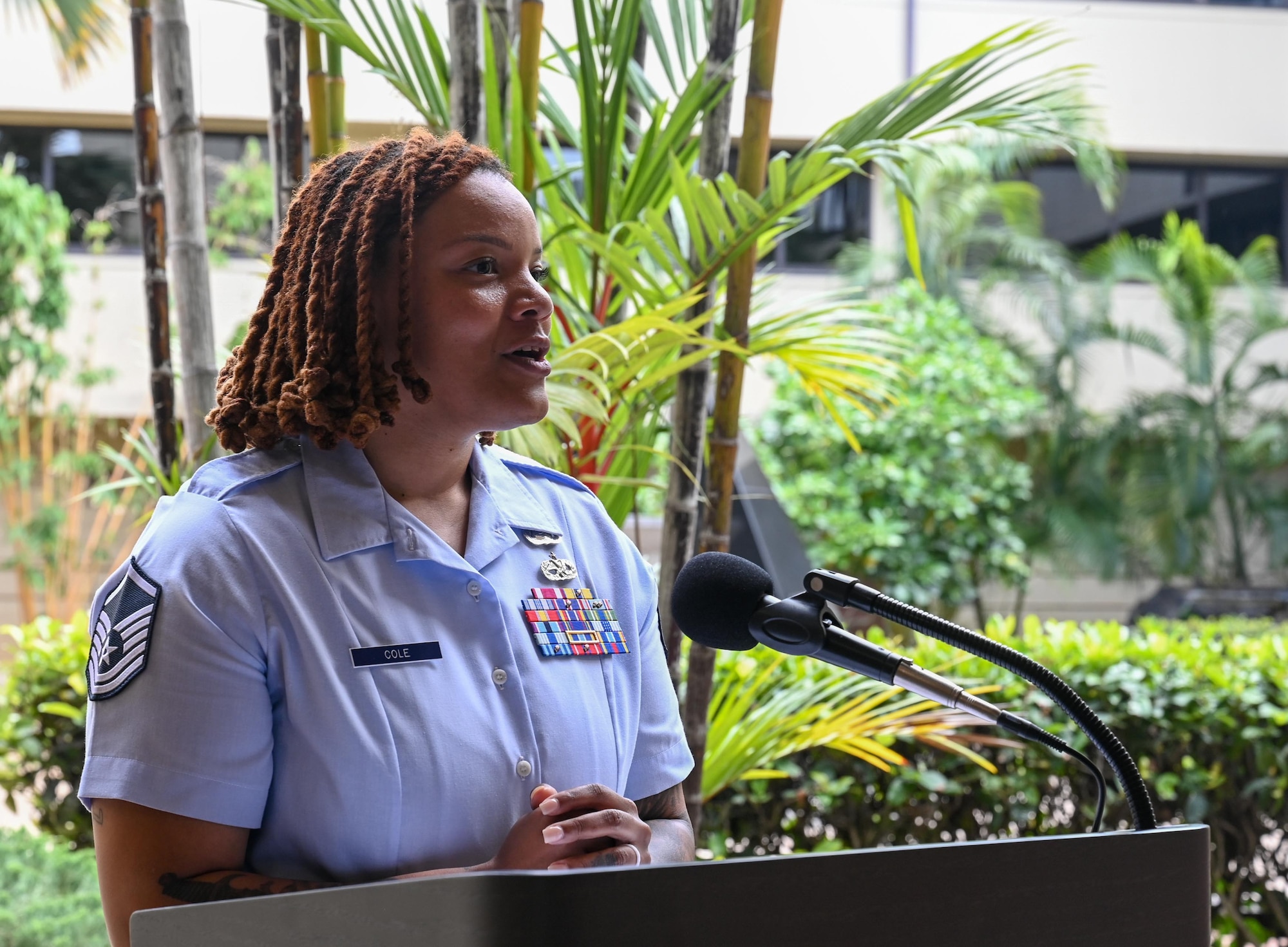 U.S. Air Force Master Sgt. Sherree Cole, Inter-Pacific Air Forces Academy operations superintendent, congratulates multinational Airmen graduating from the Inter-Pacific Junior Enlisted Leader Forum (IPJELF) at Joint Base Pearl Harbor-Hickam, Hawaii, May 19, 2025. The academy aims to equip non-commissioned officers with the leadership skills and problem-solving methods needed to succeed in multinational operational environments. (U.S. Air Force photo by Senior Airman Melody Bordeaux)