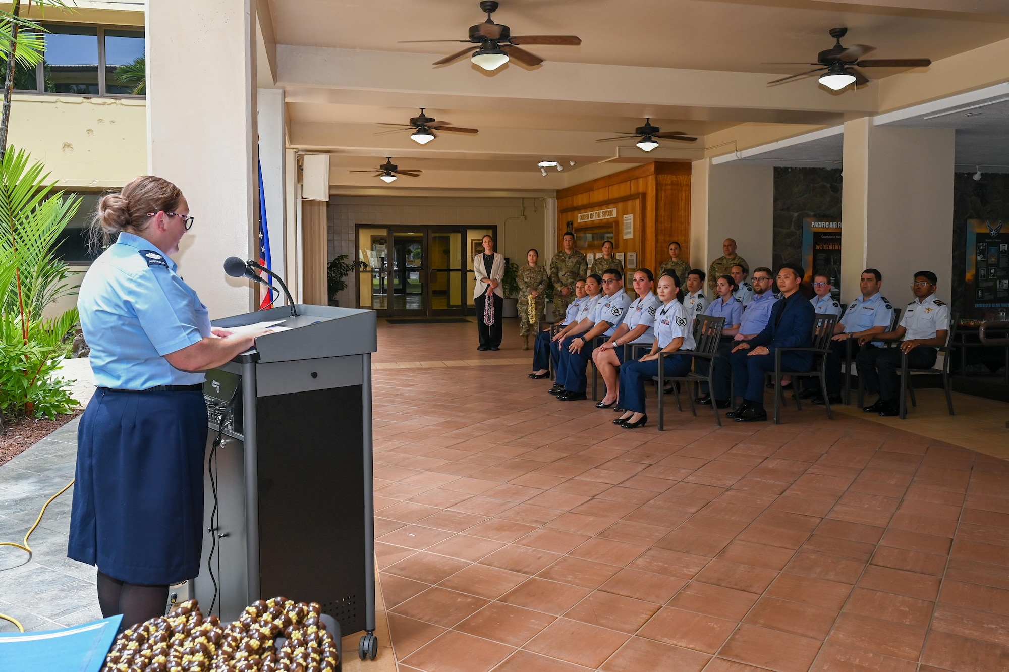Royal Australian Air Force Warrant Officer Anita Godfrey, Inter-Pacific Air Forces Academy commandant, gives remarks during the Inter-Pacific Junior Enlisted Leader Forum (IPJELF) graduation at Joint Base Pearl Harbor-Hickam, Hawaii, May 19, 2025. The academy aims to equip non-commissioned officers with the leadership skills and problem-solving methods needed to succeed in multinational operational environments. (U.S. Air Force photo by Senior Airman Melody Bordeaux)