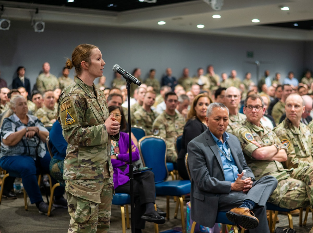 United States Air Force Maj. Brittany Curry, Space Systems Command (SSC) Public Affairs director of operations, poses a question to Chief of Space Operations Gen. Chance Saltzman during an all-call for field grade officers May 22, 2025. Gen. Saltzman visited Space Systems Command at Los Angeles Air Force Base to engage junior and senior acquisition officers in a comprehensive Q&A.  (U.S. Space Force photo by Van Ha)
