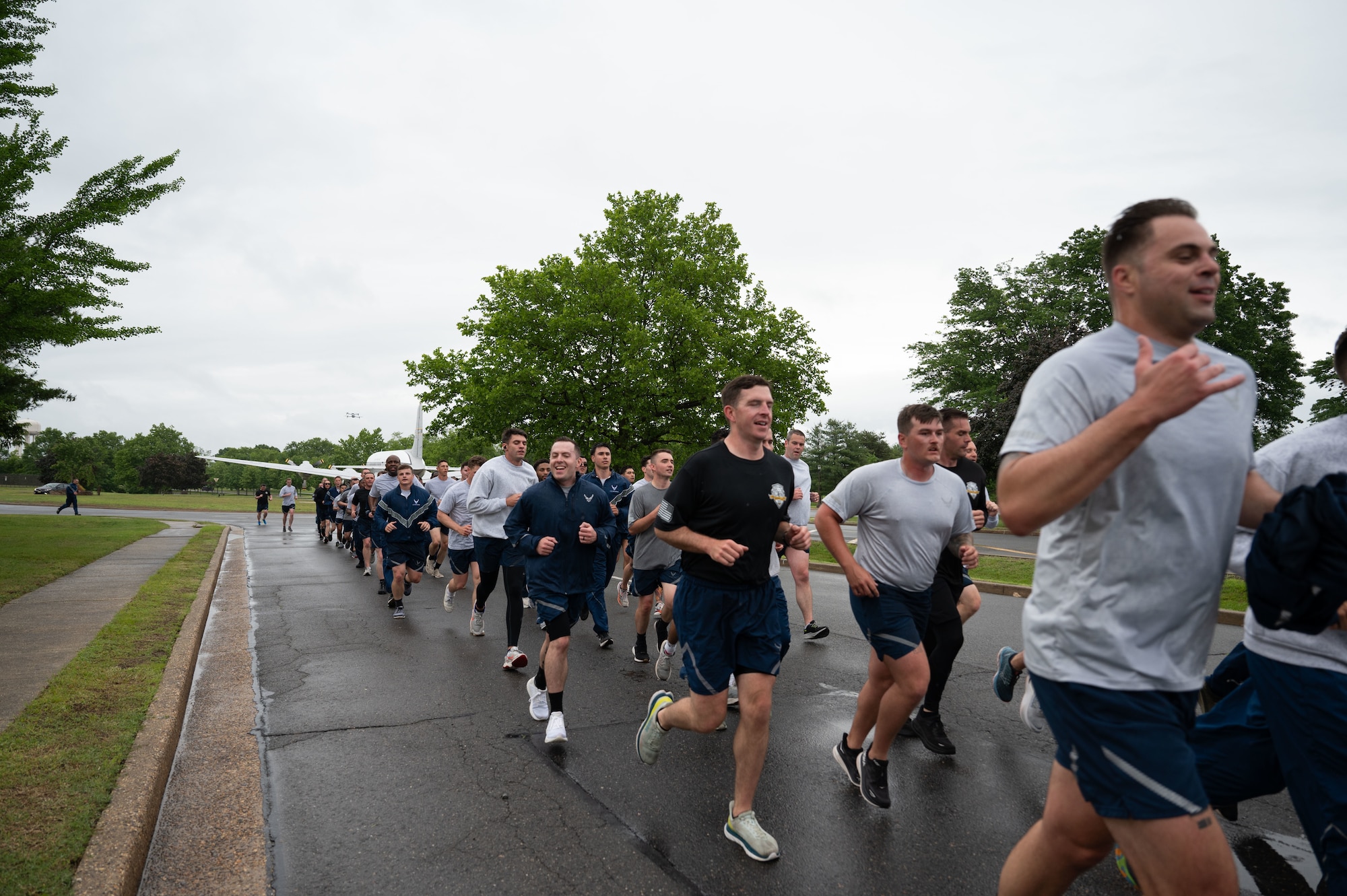 U.S. Air Force Aerial Port Squadrons from multiple wings at Joint Base McGuire-Dix-Lakehurst, N.J., participate in the annual Port Dawg Memorial Run May 21, 2025. Port Dawgs across the Air Force gather each year to run in honor of those who lost their lives in their career field. (U.S. Air Force photo by Airman Haeleigh Bayle)