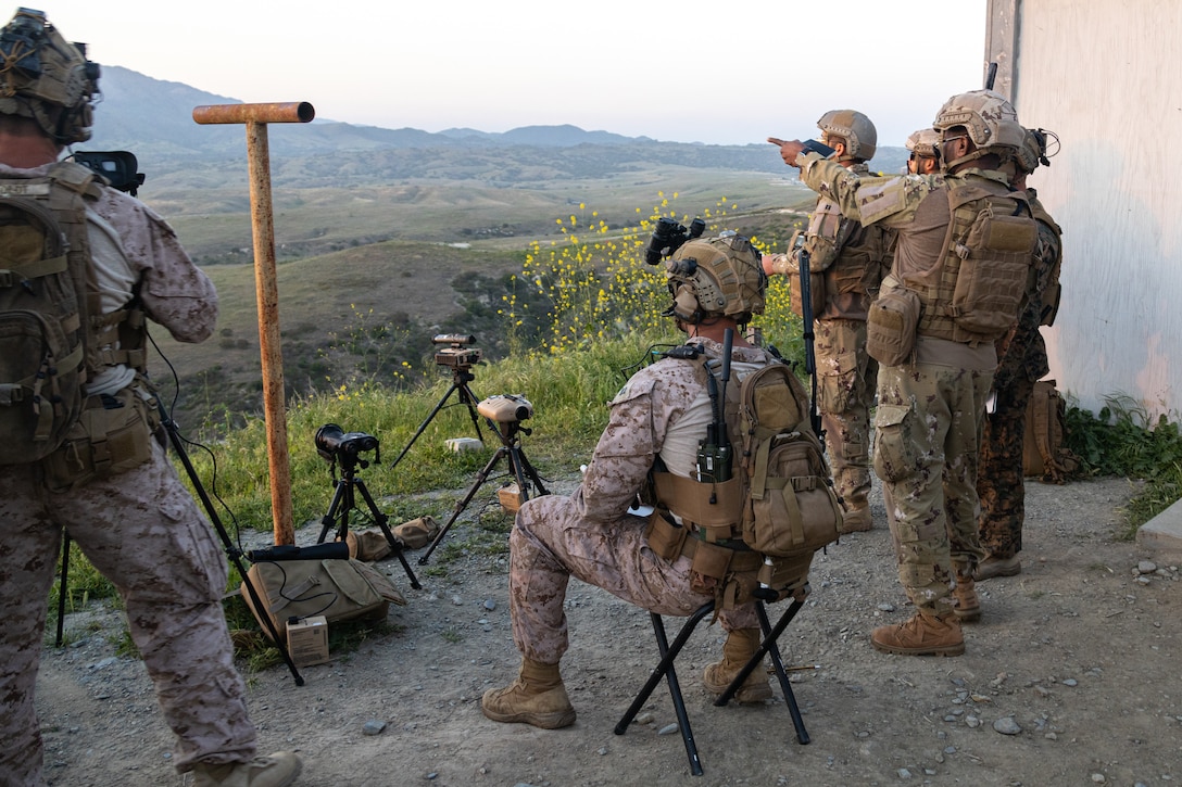 U.S. Marines with 1st Air Naval Gunfire Liaison Company, I Marine Expeditionary Force Information Group, and members of the United Arab Emirates Presidential Guard point out targets during United Arab Emirates Unit Enhancement Training at Marine Corps Base Camp Pendleton, California, May 8, 2025.