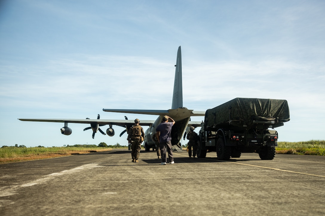 U.S. Marines with 3d Littoral Combat Team, 3d Marine Littoral Regiment, 3d Marine Division, load the Navy-Marine Expeditionary Ship Interdiction System into a KC-130J Super Hercules assigned to Marine Aerial Refueler Transport Squadron (VMGR) 352 during the Maritime Key Terrain Security Operation as a part of Exercise KAMANDAG 9 in the Philippines, May 25, 2025.