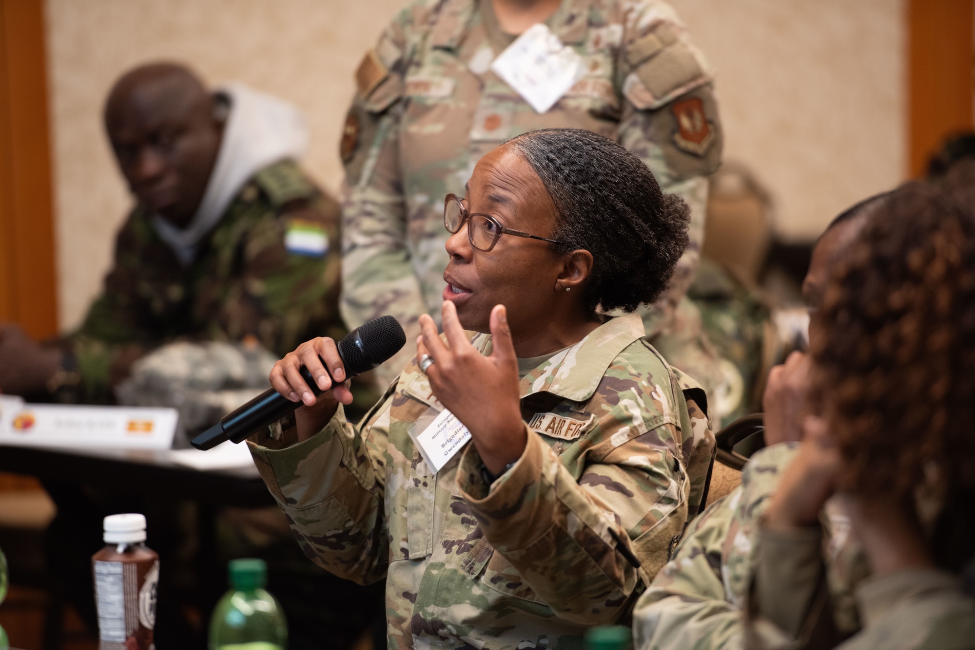 U.S. Air Force Brig. Gen. Gwendolyn Foster, 59th Medical Wing commander, asks a question during a briefing at the European-African Military Nursing Exchange conference in Garmisch-Partenkirchen, Germany, May 22, 2025. Medical professionals from various countries discussed ethics and end-of-life care on the battlefield, the role of military nursing in promoting peace and stability in unstable regions, and effective leadership strategies for military nursing officers. (U.S. Air Force photo by Airman 1st Class Jason Jones Jr.)