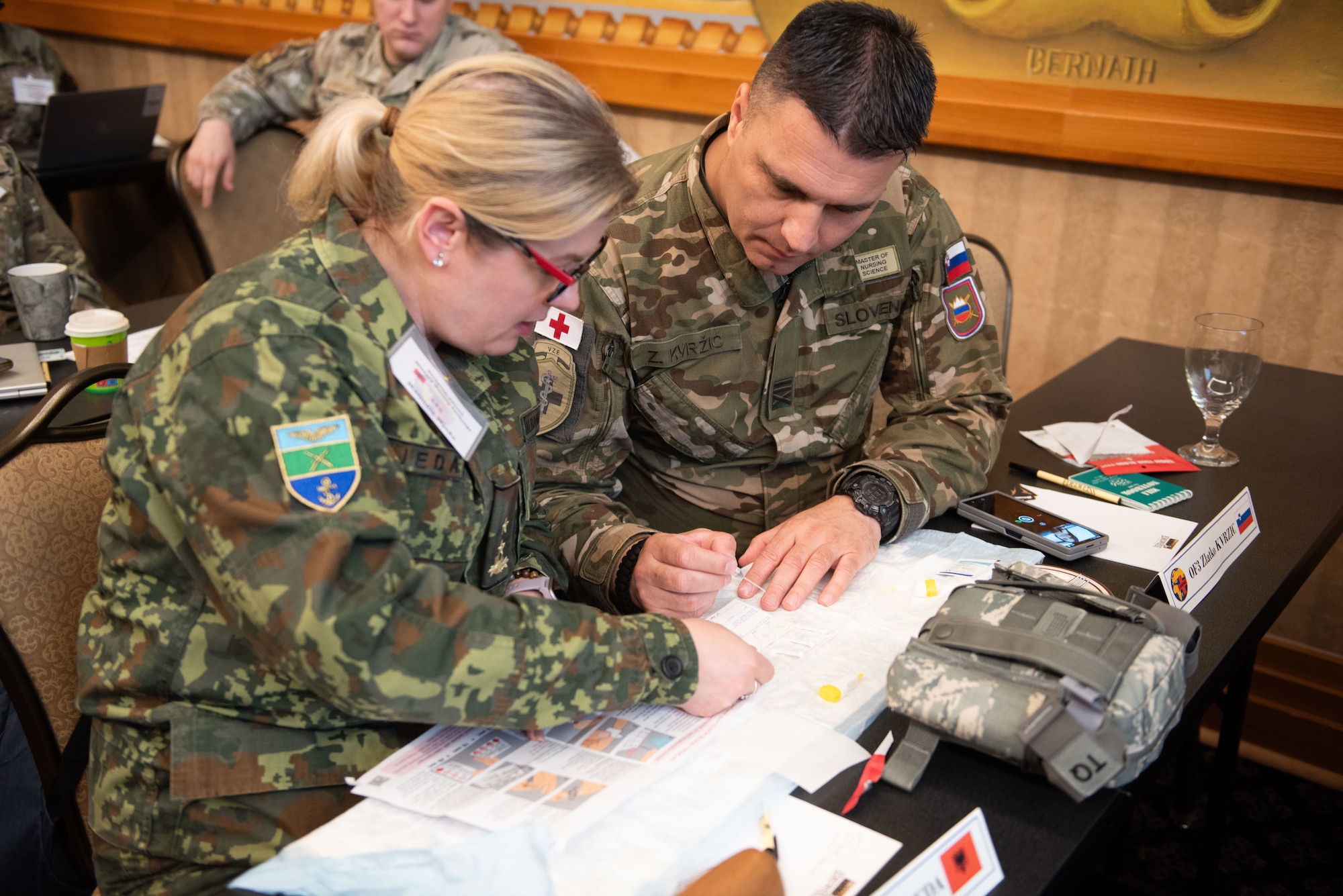 A U.S. Airman and medical professionals from Kenya, Albania and Montenegro discuss their team plan during a training exercise at the European-African Military Nursing Exchange conference in Garmisch-Partenkirchen, Germany, May 22, 2025. The training exercises strengthened critical hands-on skills while also enhancing collaboration and interoperability between the U.S. Air Force and its partner nations. (U.S. Air Force photo by Airman 1st Class Jason Jones Jr.)