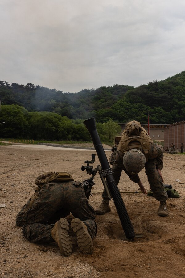 U.S. Marines with 2nd Battalion, 23rd Marines, forward deployed with 4th Marine Regiment, 3d Marine Division as part of the Unit Deployment Program, fire an M252 81 mm mortar during Korea Viper 25.4 at Camp Rodriguez, South Korea, May 23, 2025. Korea Viper is a recurring exercise series that demonstrates the Republic of Korea and U.S. Marine Corps' ability to respond decisively in the region as a singular, unified force while strengthening relationships and trust between the two allies. (U.S. Marine Corps photo by Lance Cpl. Tucker Mocan)