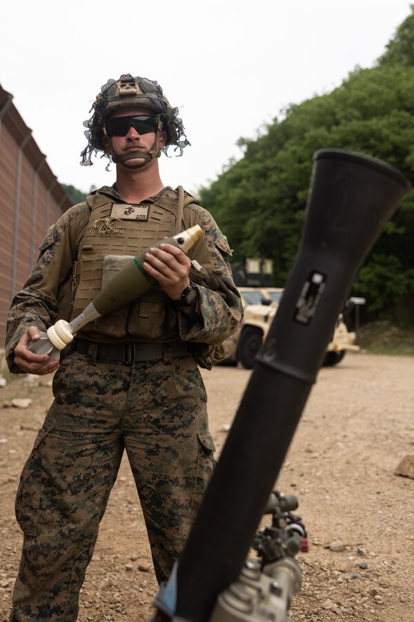 U.S. Marine Corps Lance Cpl. Bennie Adarr, a machine gunner with 2nd Battalion, 23rd Marines forward deployed with 4th Marine Regiment, 3d Marine Division as part of the Unit Deployment Program, prepares to fire an M252 81 mm mortar during Korea Viper 25.4 at Camp Rodriguez, South Korea, May 23, 2025. Korea Viper is a recurring exercise series that demonstrates the Republic of Korea and U.S. Marine Corps' ability to respond decisively in the region as a singular, unified force while strengthening relationships and trust between the two allies. Adarr is a native of Missouri. (U.S. Marine Corps photo by Lance Cpl. Tucker Mocan)
