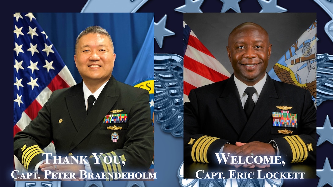 Two U.S. Navy officers in dress uniform