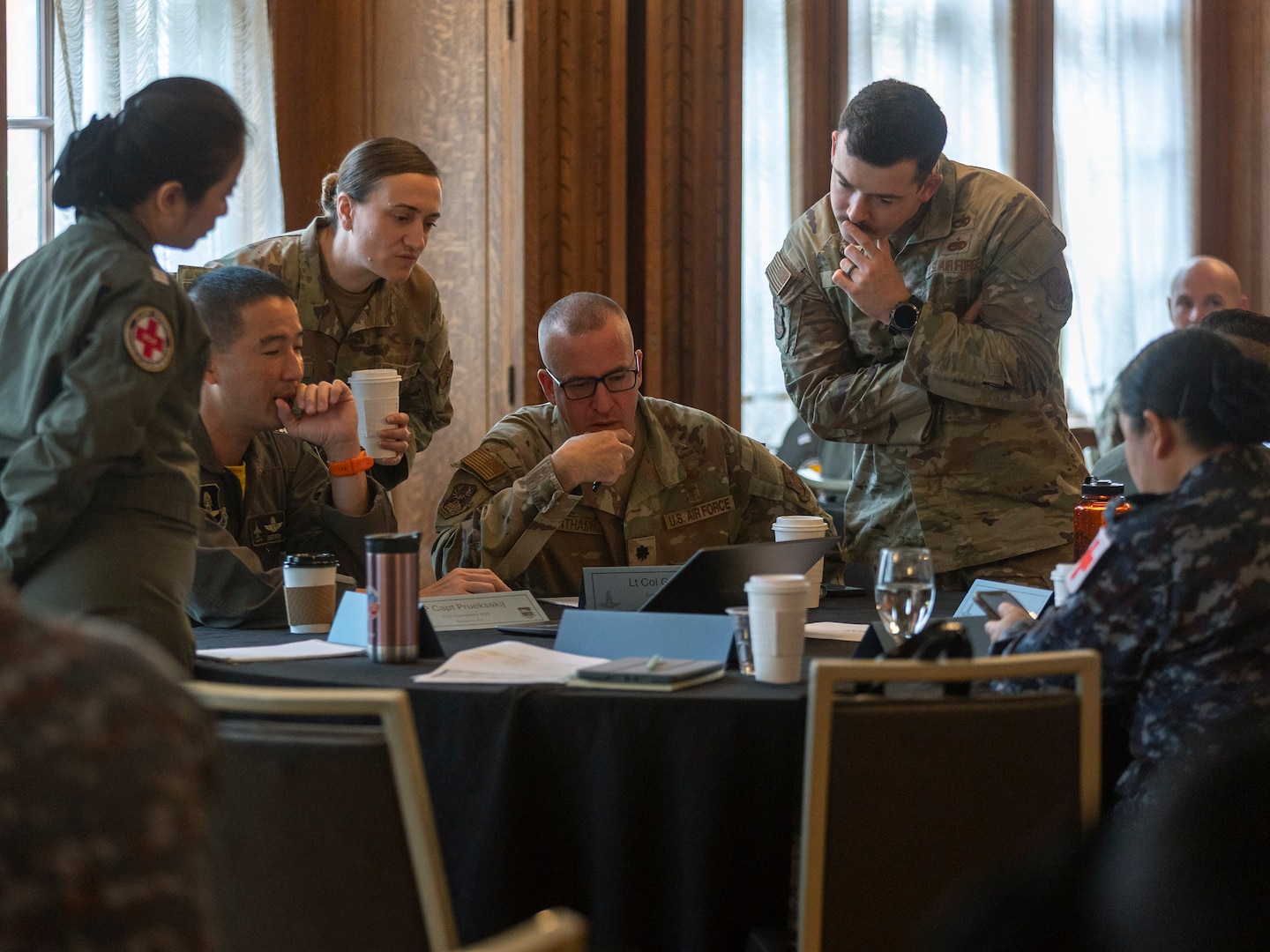 Airmen with the Washington Air National Guard and the Royal Thai Air Force work alongside their RTAF counterparts in small groups to finalize their respective training objectives at the Enduring Partners 2025 final planning conference in Spokane, Wash., May 19, 2025.