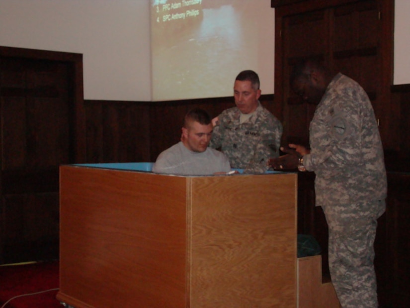 Chaplain (Cpt.) William Draper hold a baptism service where he baptized 12 Soldiers while at their mobilization station prior to his deployment to Afghanistan with the 201st Engineer Battalion in 2008-2009.
