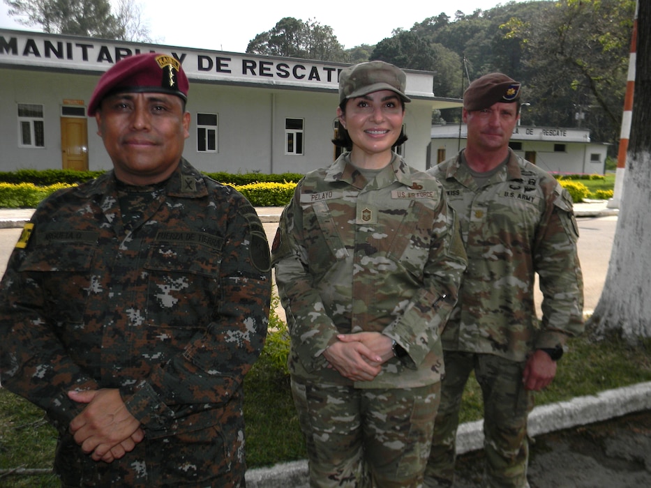 U.S. Air Force Chief Master Sgt. Karla Pelayo, from the Air Force’s Language Enabled Airman Program, poses May 21, 2025, on Mariscal Zavala military base with Col. Victor Argueta Oscal of the Guatemalan army, who commanded the combined task force in CENTCAM Guardian 2025, and U.S. Army Maj. Brian Hotchkiss, an advisor from the 1st Security Forces Assistance Brigade, for whom she interpreted daily. CENTAM Guardian, an annual, multinational exercise, fosters strong partnerships by enabling combined forces to effectively address shared security challenges. The Air Force’s Language Enabled Airman Program, to which Pelayo belongs, includes more than 3,700 service members who bridge language and cultural barriers with allies and partners to create a more interoperable, lethal force. (U.S. Navy photo by Cmdr. Michael Cody)