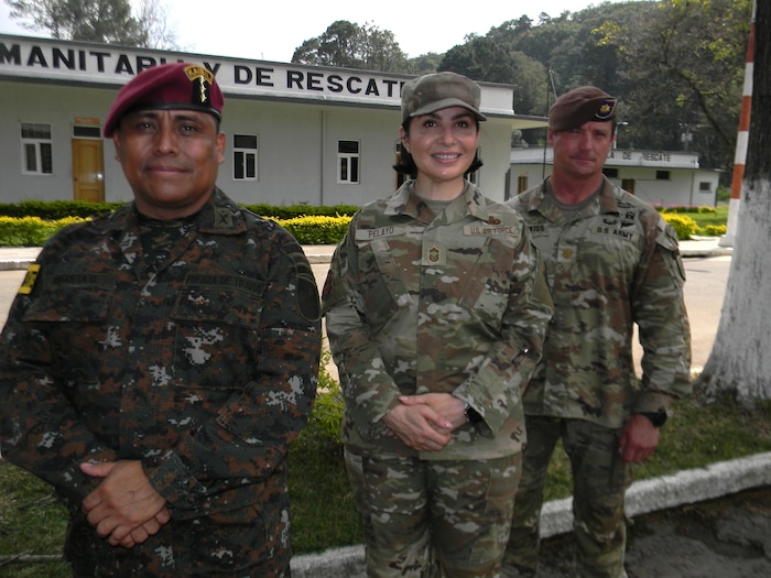 U.S. Air Force Chief Master Sgt. Karla Pelayo, from the Air Force’s Language Enabled Airman Program, poses May 21, 2025, on Mariscal Zavala military base with Col. Victor Argueta Oscal of the Guatemalan army, who commanded the combined task force in CENTCAM Guardian 2025, and U.S. Army Maj. Brian Hotchkiss, an advisor from the 1st Security Forces Assistance Brigade, for whom she interpreted daily. CENTAM Guardian, an annual, multinational exercise, fosters strong partnerships by enabling combined forces to effectively address shared security challenges. The Air Force’s Language Enabled Airman Program, to which Pelayo belongs, includes more than 3,700 service members who bridge language and cultural barriers with allies and partners to create a more interoperable, lethal force. (U.S. Navy photo by Cmdr. Michael Cody)