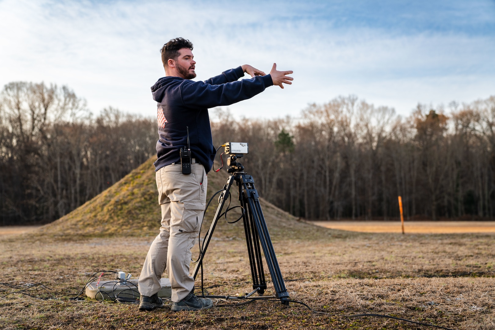 PUMPKIN NECK, Va. — Spencer Gray, an instrumentation technician at the Integrated Engagement Systems Department, sets and adjusts a video camera before a test event at the Naval Surface Warfare Center Dahlgren Division’s Explosive Experimental Area. (Dorina Watermolen/NSWCDD Photo)