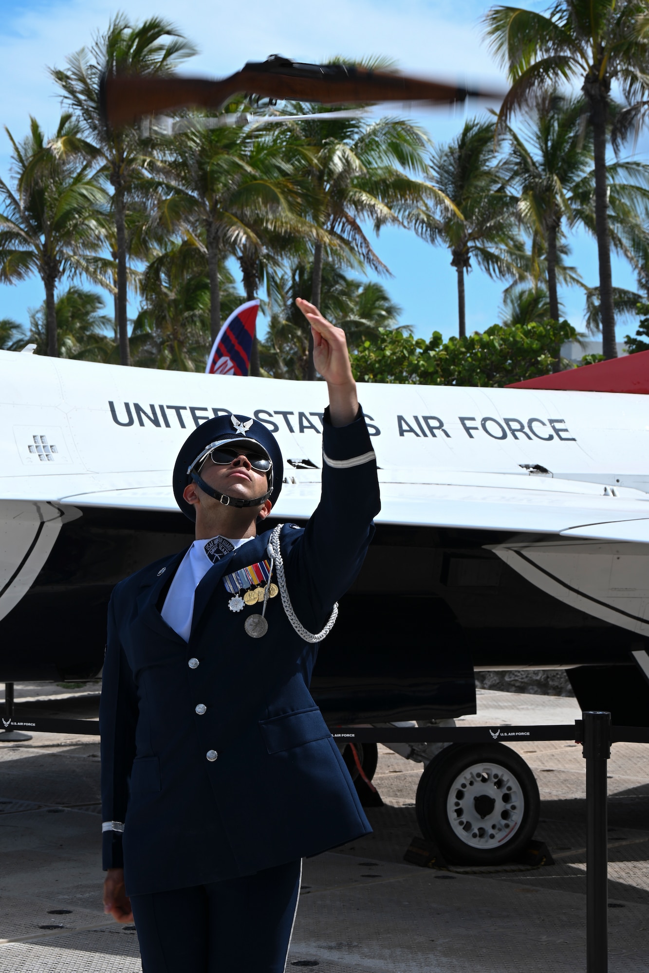 U.S. Air Force Senior Airman Wijeury Collado, U.S. Air Force Honor Guard ceremonial guardsman, performs a rifle flip at the Hyundai Air & Sea Show at Miami Beach, Fla., May 24, 2025.