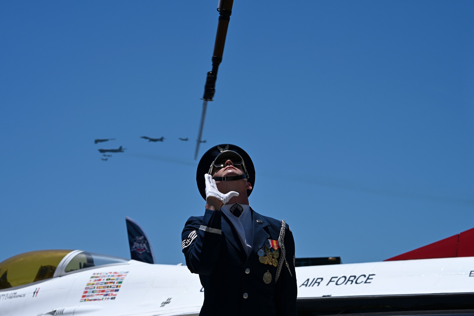 U.S. Air Force Staff Sgt. William Douglass, U.S. Air Force Honor Guard ceremonial guardsman, performs a rifle flip during a flyover at the Hyundai Air & Sea Show at Miami Beach, Fla., May 25, 2025.