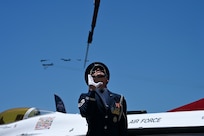 U.S. Air Force Staff Sgt. William Douglass, U.S. Air Force Honor Guard ceremonial guardsman, performs a rifle flip during a flyover at the Hyundai Air & Sea Show at Miami Beach, Fla., May 25, 2025.
