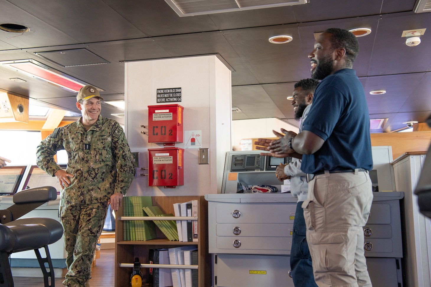 Vice Adm. John Gumbleton, commander, Task Force 80 and deputy commander, U.S. Fleet Forces Command, left, speaks with the ship's crew aboard training support vessel (TSV) 5 Vindicator assigned to Training Support Vessel Squadron (TSVRON) 4 at Naval Amphibious Base Little Creek, Va., Feb. 24, 2025.