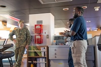 Vice Adm. John Gumbleton, commander, Task Force 80 and deputy commander, U.S. Fleet Forces Command, left, speaks with the ship's crew aboard training support vessel (TSV) 5 Vindicator assigned to Training Support Vessel Squadron (TSVRON) 4 at Naval Amphibious Base Little Creek, Va., Feb. 24, 2025.