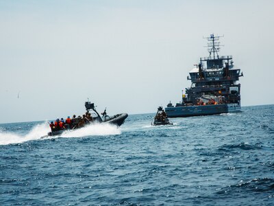U.S. Marines with Maritime Special Purpose Force, 22nd Marine Expeditionary Unit, approach a vessel in enhanced rigid-hull inflatable boats to conduct maritime interception operations aboard U.S. Navy training support vessel USNS Vindicator (TSV5) in support of Iwo Jima Amphibious Ready Group Marine Expeditionary Unit Exercise (ARGMEUEX) while underway in the Atlantic Ocean, May 18, 2025.