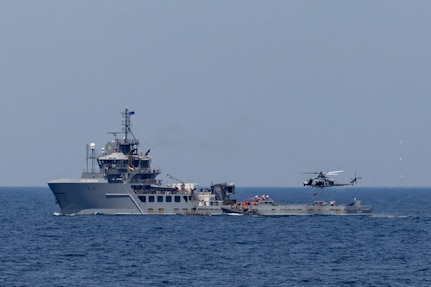 U.S. Marines with Maritime Special Purpose Force, Marine Medium Tiltrotor Squadron 263 (Reinforced), and Weapons Company, Battalion Landing Team 3/6, all with 22nd Marine Expeditionary Unit, and U.S. Navy Helicopter Sea Combat Squadron 26, conduct maritime interception operations aboard the Training Support Vessel (TSV) 5 Vindicator, Training Support Vessel Squadron 4, during Amphibious Ready Group MEU exercise (ARGMEUEX), while underway in the Atlantic Ocean, May 18, 2025.