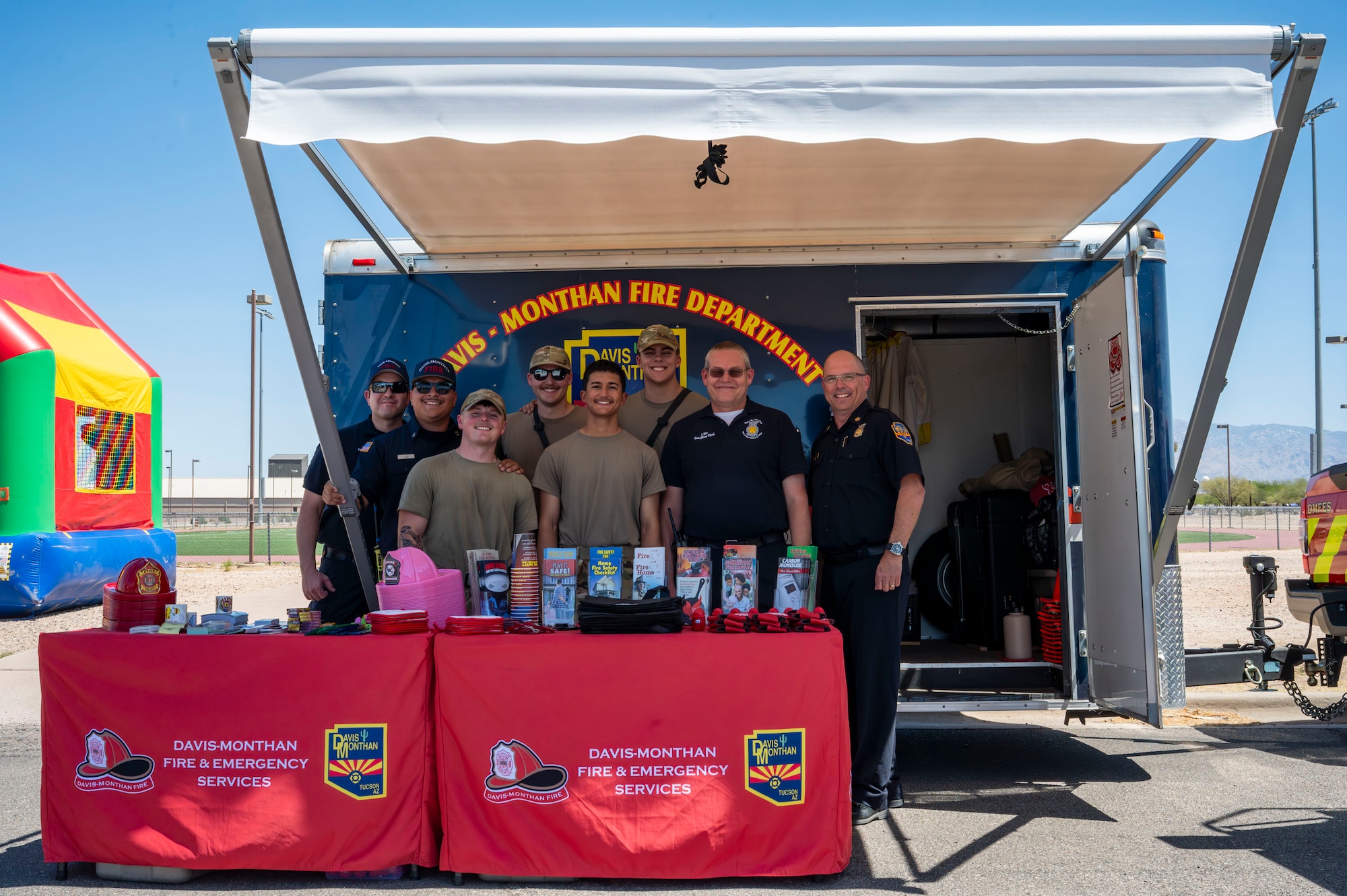 U.S. Airmen from the 355th Civil Engineer Squadron pose for a photo during the Health Fair at Davis-Monthan Air Force Base, Arizona, May 28, 2025. Through interactive booths and wellness demonstrations, the 355th Medical Group’s Health Fair aimed to equip attendees with tools for long-term health and mission success.  (U.S. Air Force photo by Airman Samantha Melecio)
