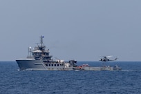 U.S. Marines with Maritime Special Purpose Force, Marine Medium Tiltrotor Squadron 263 (Reinforced), and Weapons Company, Battalion Landing Team 3/6, all with 22nd Marine Expeditionary Unit, and U.S. Navy Helicopter Sea Combat Squadron 26, conduct maritime interception operations aboard the Training Support Vessel (TSV) 5 Vindicator, Training Support Vessel Squadron 4, during Amphibious Ready Group MEU exercise (ARGMEUEX), while underway in the Atlantic Ocean, May 18, 2025.
