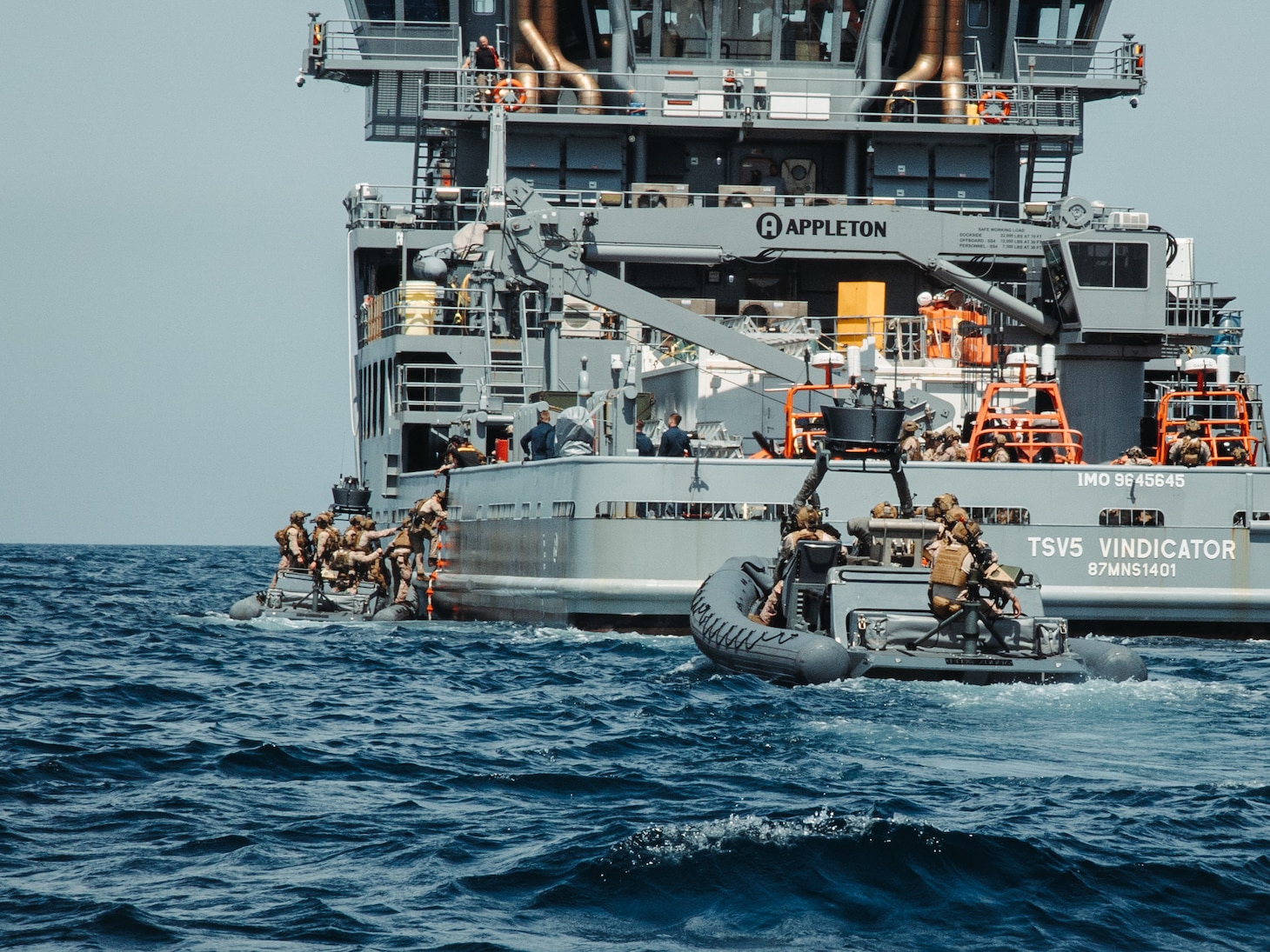 U.S. Marines with Maritime Special Purpose Force, 22nd Marine Expeditionary Unit, board a vessel in rigid-hull inflatable boats while conducting maritime interception operations aboard U.S. Navy training support vessel USNS Vindicator (TSV5) in support of Iwo Jima Amphibious Ready Group Marine Expeditionary Unit Exercise (ARGMEUEX) while underway in the Atlantic Ocean, May 18, 2025.