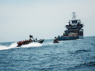 U.S. Marines with Maritime Special Purpose Force, 22nd Marine Expeditionary Unit, approach a vessel in enhanced rigid-hull inflatable boats to conduct maritime interception operations aboard U.S. Navy training support vessel USNS Vindicator (TSV5) in support of Iwo Jima Amphibious Ready Group Marine Expeditionary Unit Exercise (ARGMEUEX) while underway in the Atlantic Ocean, May 18, 2025.