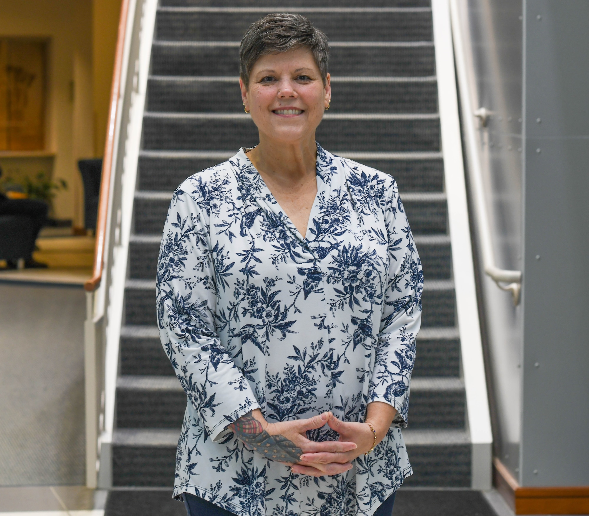 Terri Ann Naughton, 910th Airlift Wing director of psychological health, poses for a photo inside of the wing headquarters building on May 22, 2025, at Youngstown Air Reserve Station, Ohio.
