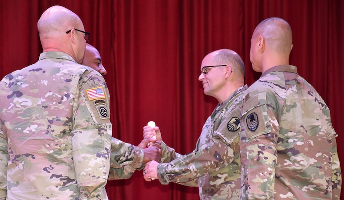 CW5 John P. Peart assumes responsibility during a Change of Charter ceremony