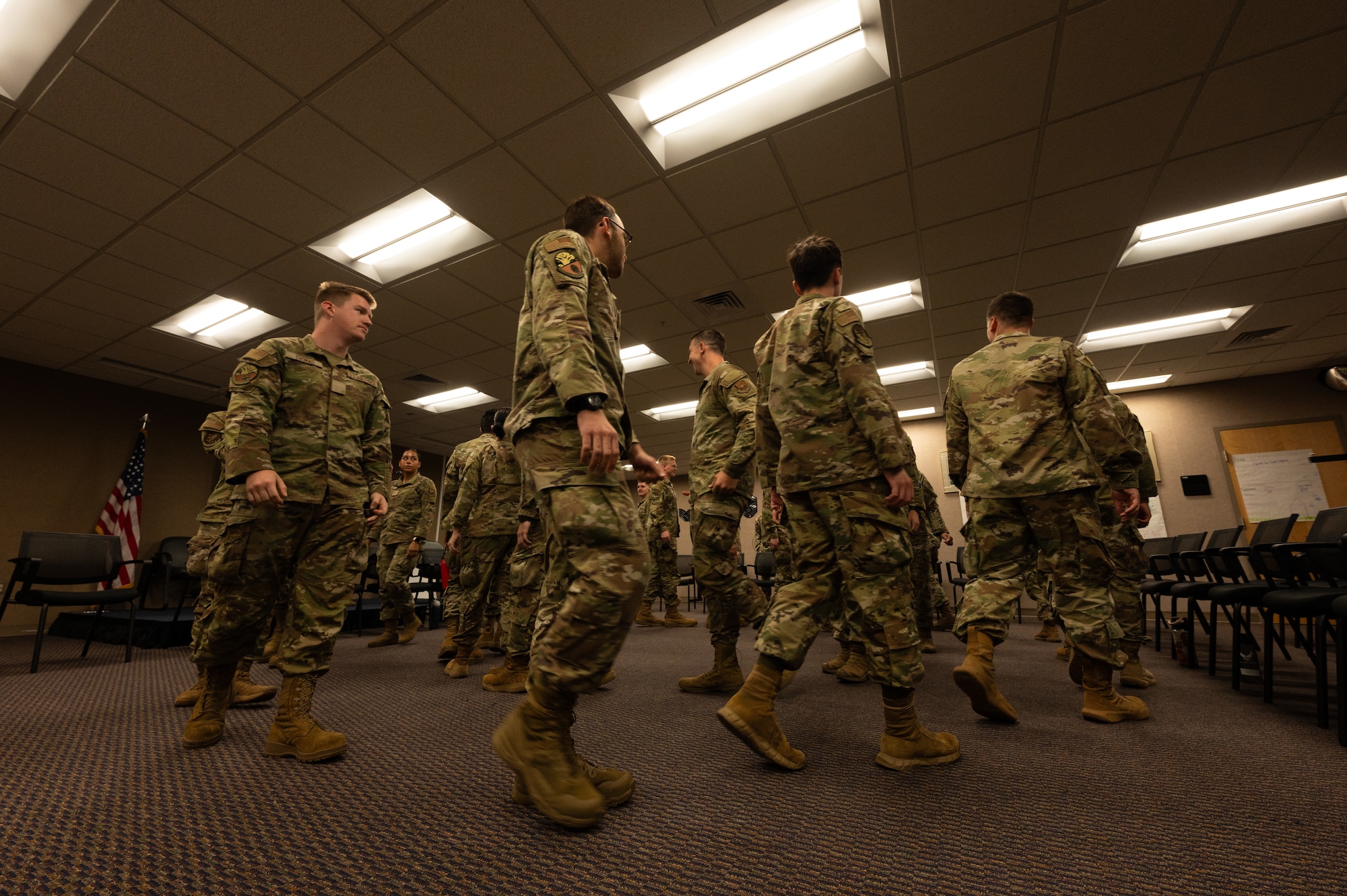 First Term Airmen conduct a team building exercise during a Wingman Guardian Connect class at Whiteman Air Force Base, Missouri, May 13, 2025. The WGC program is designed for FTA and incorporates workshops, team activities and open discussions to encourage social connection and strengthen resilience. (U.S. Air Force photo by Senior Airman Joseph Garcia)