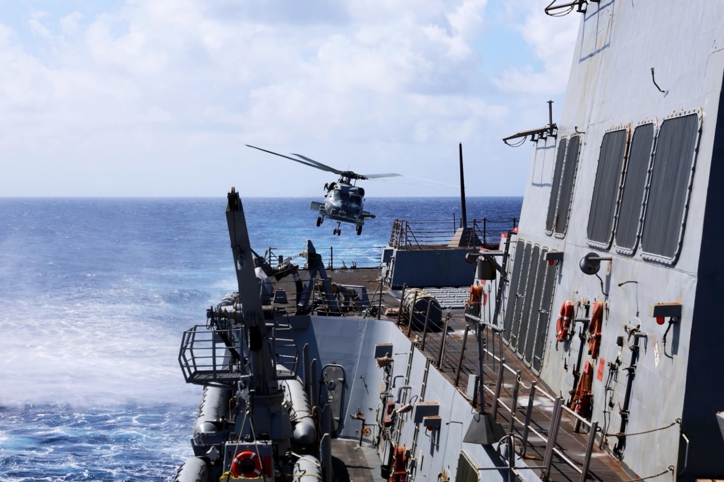 An MH-60R Sea Hawk helicopter assigned to Helicopter Maritime Strike Squadron (HSM) 74, the “Swamp Foxes,” lifts off from the flight deck of the Arleigh Burke-class guided-missile destroyer USS Gravely (DDG 107) to conduct a routine maritime interdiction operation patrol while underway in the Caribbean Sea.