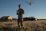 U.S. Air Force Chief Warrant Officer 2 Robert Peck, officer of information technology with 242nd Combat Communications Squadron, Washington Air National Guard, operates a small unmanned aircraft system during Exercise Phoenix Dawn 2025 at Saylor Creek Range near Mountain Home Air Force Base, Idaho, May 6, 2025. The 194th Wing's inaugural class of Warrant Officers are paving the way by re-establishing the role in the Air Force and setting standards for future generations.