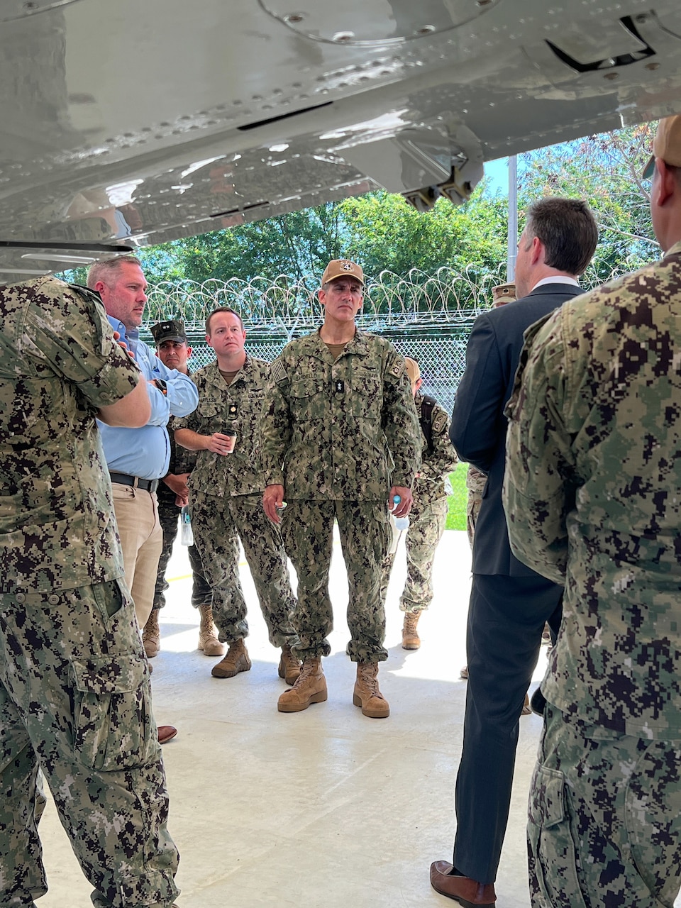U.S. Naval Forces Southern Command / U.S. 4th Fleet Commander Rear Adm. Carlos Sardiello, center, receives an overview of the Hybrid Fleet Campaign (HFC) Fleet Experiment (FLEX) manned and unmanned systems integration field tests during the FLEX showcase event at CSL Comalapa near San Salvador, El Salvador, May 27, 2025. HFC is a learning campaign to retain and improve advantages using next-generation manned and unmanned systems, tested and integrated during and after FLEX. U.S. Naval Forces Southern Command/U.S. 4th Fleet is the maritime component of U.S. Southern Command and the trusted maritime partner for Caribbean, Central and South America maritime forces leading to improved unity, security and stability.