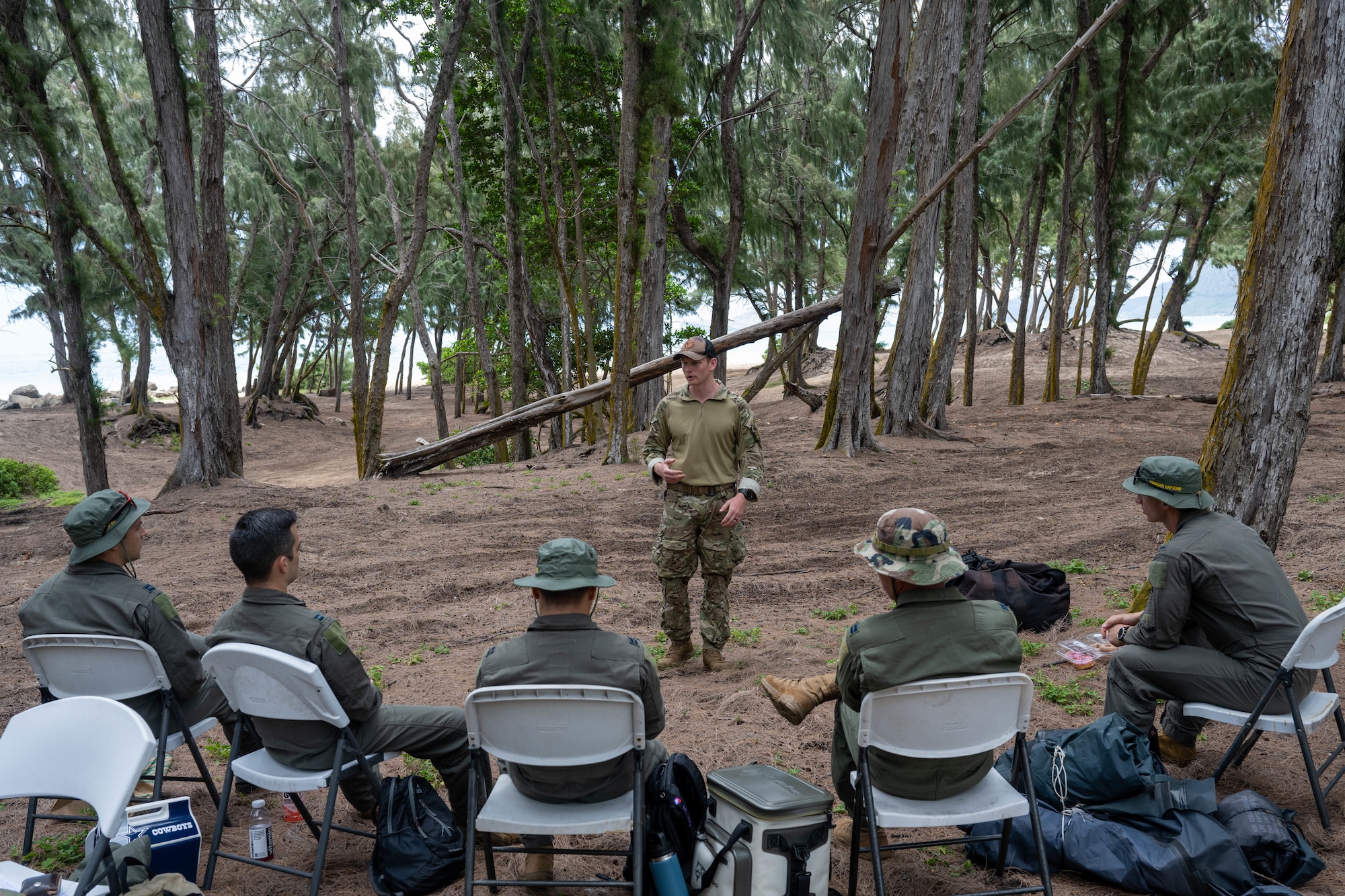A U.S. Air Force Airman talks to pilots on techniques of how to survive in the wild in the event they find themselves on the ground.