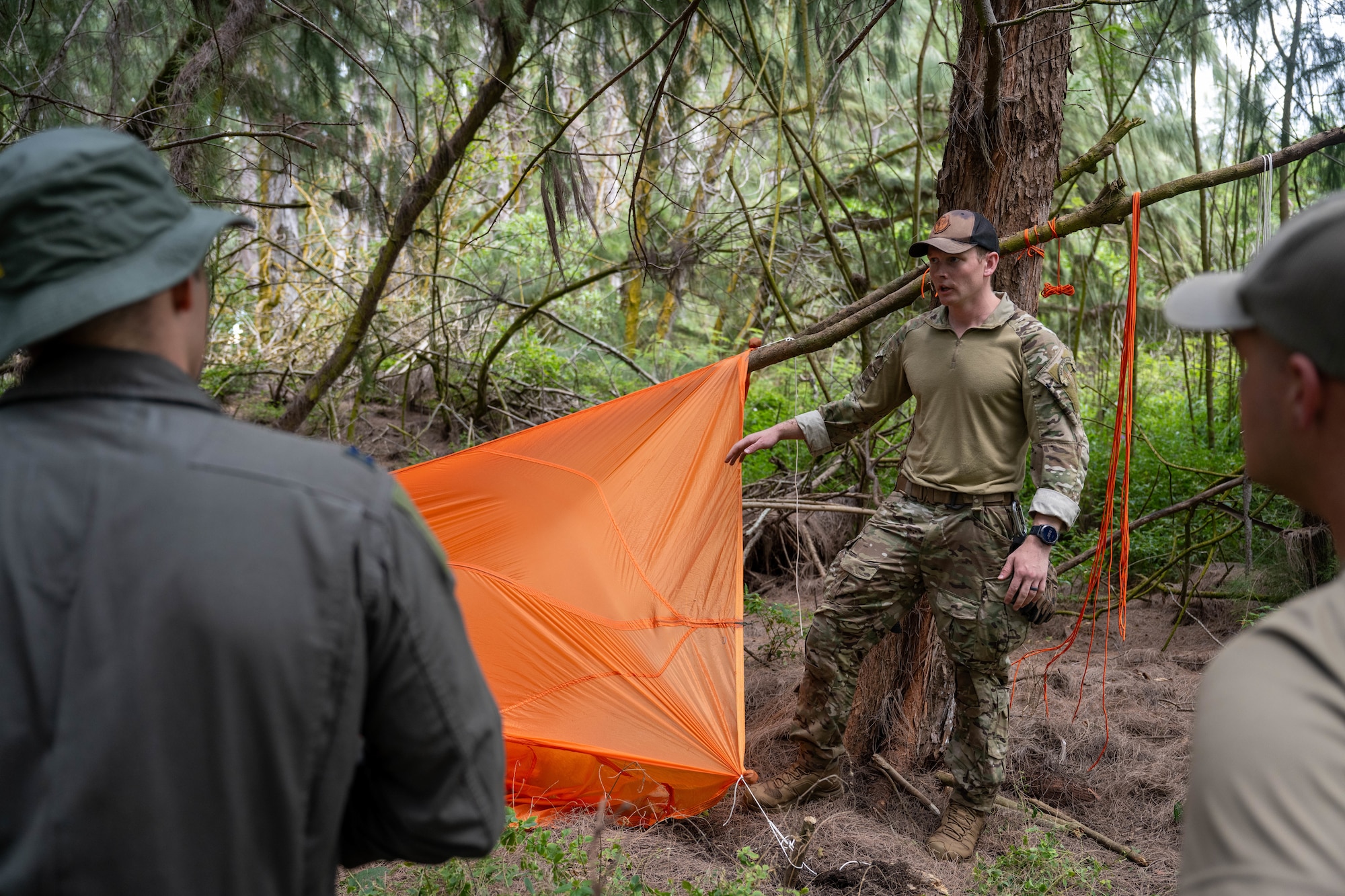 A U.S. Air Force Airman teaches pilots how to create a makeshift shelter in the wild using anything available.