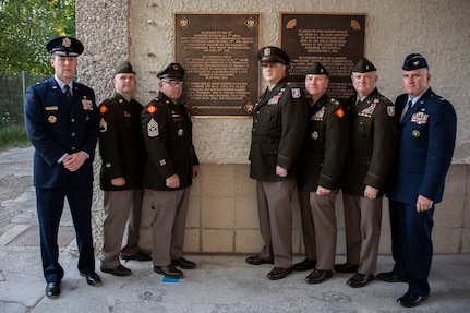 Leaders with the Oklahoma National Guard gather in front of a new plaque honoring Soldiers of the 45th Infantry Division who assisted in the liberation of the Dachau Concentration Camp in 1945 at the Dachau Concentration Camp Memorial Site in Dachau, Germany, April 29, 2025. The Oklahoma National Guard members helped dedicate a newly placed plaque honoring the Soldiers of the 45th Infantry Division for their role in liberating the camp on the 80th anniversary of the camp’s liberation. (Oklahoma National Guard Photo by Staff Sgt. Anthony Jones)