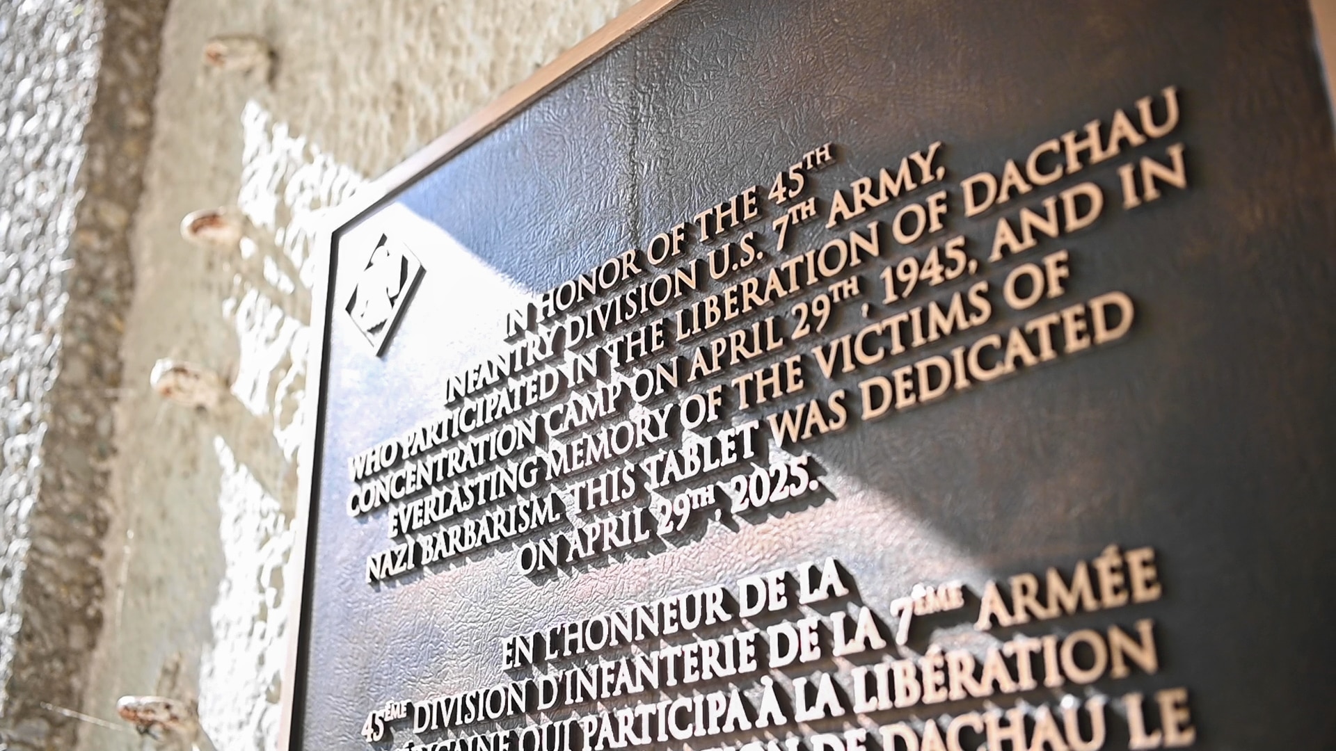 A plaque commemorating the Soldiers of the 45th Infantry Division who helped liberate the Dachau Concentration Camp on April 29, 1945, and honoring the memory of Holocaust victims, is displayed at the Dachau Concentration Camp Memorial Site in Germany. Unveiled on the 80th anniversary of the camp’s liberation, the April 29, 2025 ceremony included members of the Oklahoma National Guard, 45th Infantry Division Association, a Holocaust survivor, a 20th Armored Division veteran, and representatives from the Bavarian Memorial Foundation and the Comité International de Dachau. (Oklahoma National Guard Photo by Staff Sgt. Anthony Jones)