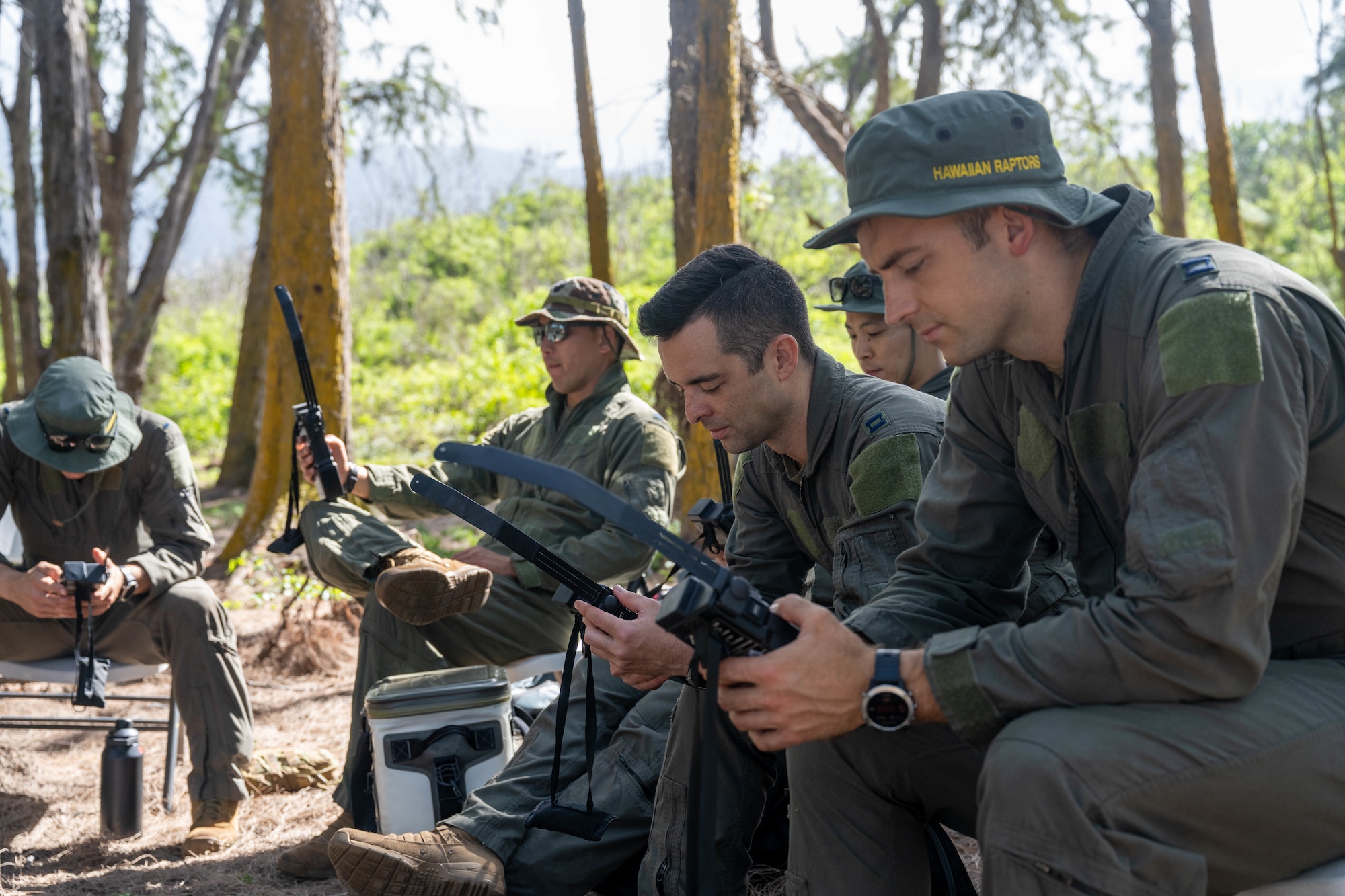 U.S. Air Force pilots practice use handheld radios before participating in combat survival training.