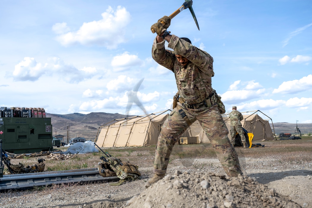 Airman digs a hole