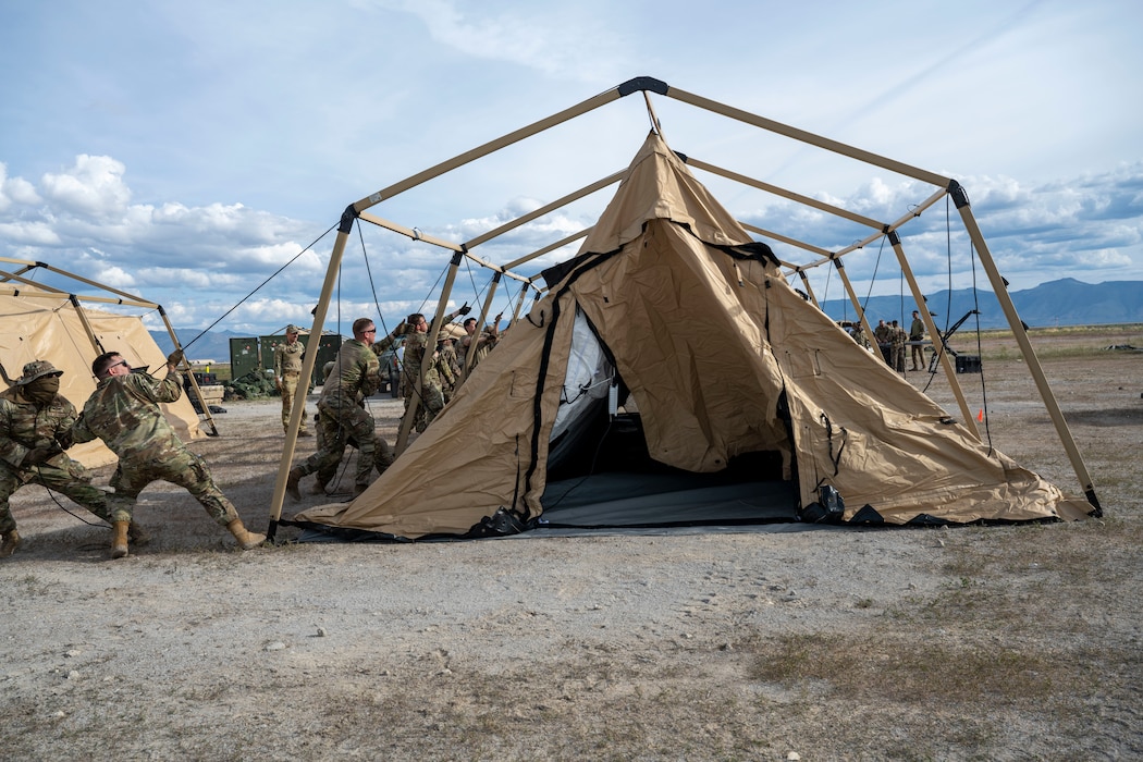 Airmen set up a tent