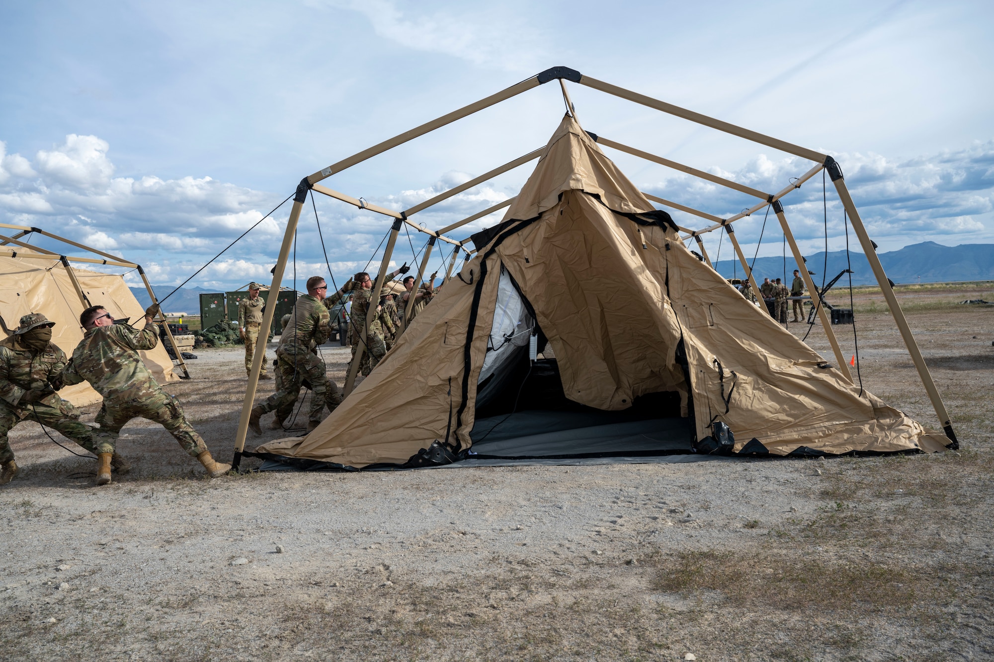 Airmen set up a tent