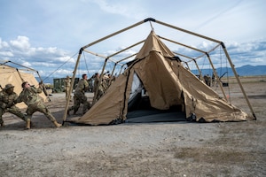 Airmen set up a tent
