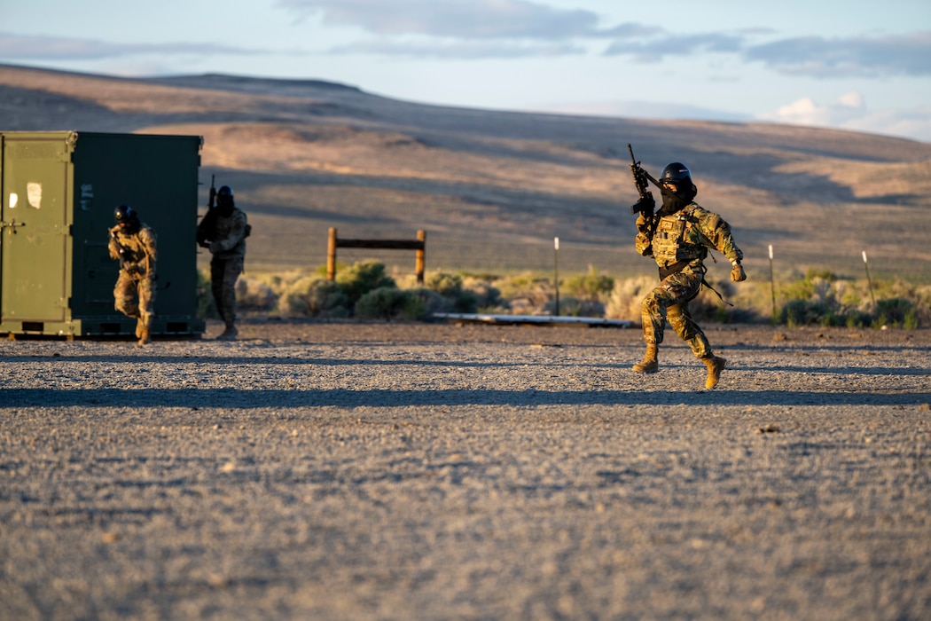 Airman runs with weapon