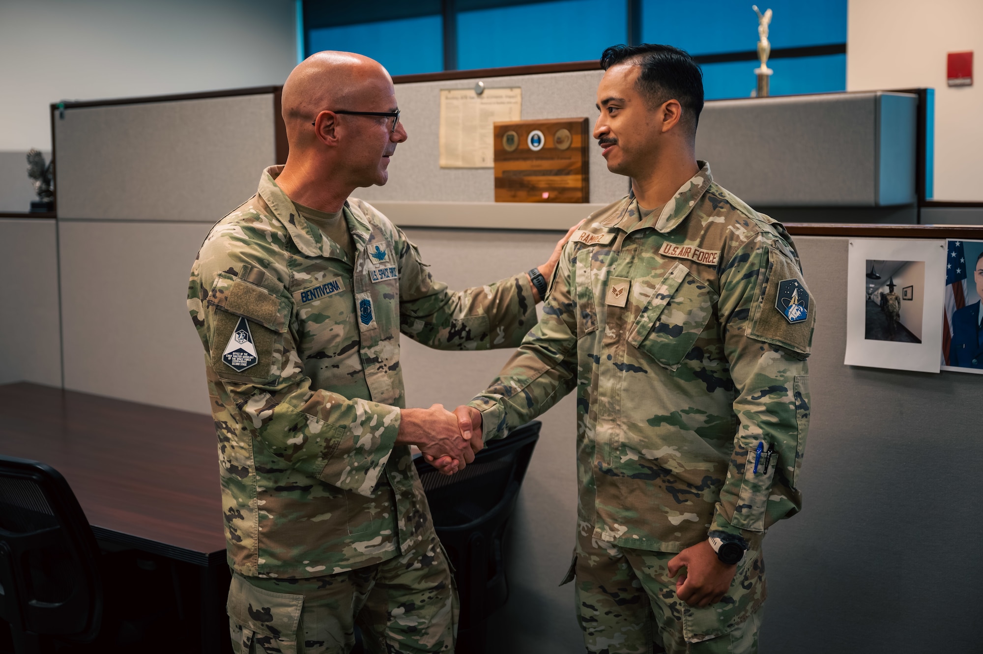 Two men shake hands