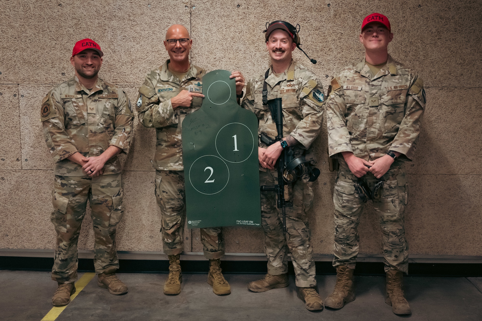 four men pose for a photo