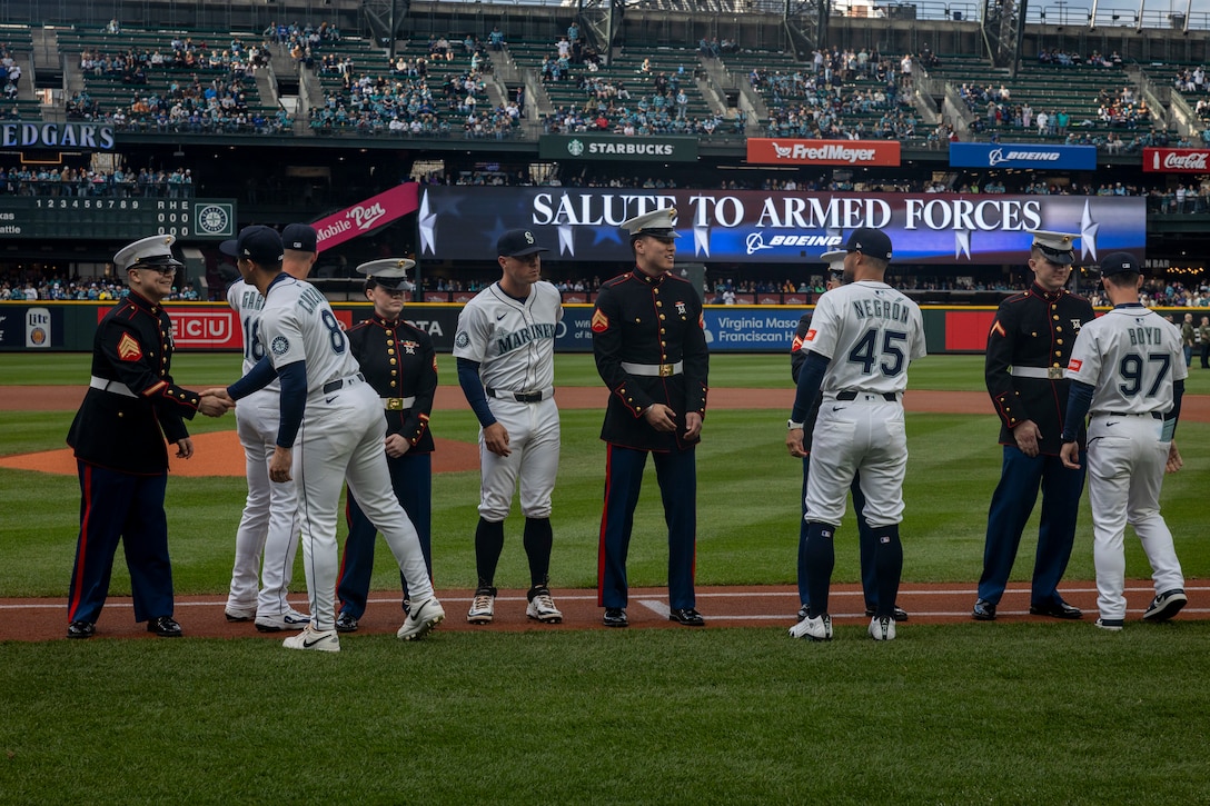 U.S. Marines with 6th Air Naval Gunfire Liaison Company meet Seattle Mariners players during the Seattle Mariners’ Salute to Armed Forces Night at T-Mobile Park in Seattle, April 12, 2025. The annual event honors service members from all branches and featured a joint-service enlistment ceremony with 71 future service members. (U.S. Marine Corps photo by Sgt. Hunter Wagner)