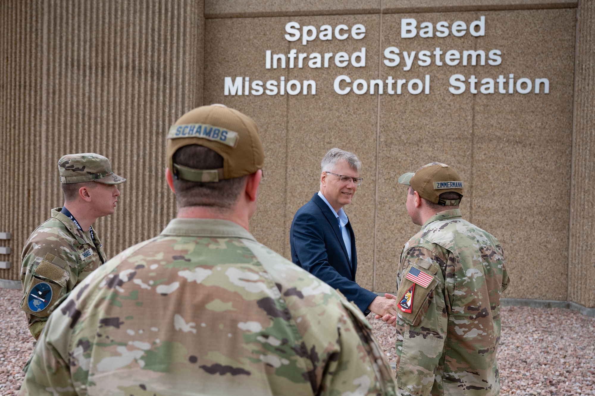 Secretary of the Air Force Troy Meink engages with U.S. Space Force Guardians assigned to Mission Delta 4 (Missile Warning) at Schriever Space Force Base, Colorado, May 28, 2025. Space Operations Command Guardians and Airmen demonstrated their combat readiness and warrior ethos, providing Meink with a deep dive into multiple critical mission areas, to include Space Domain Awareness; Electromagnetic Warfare; Missile Warning; Intelligence, Surveillance, Reconnaissance and Targeting; Orbital Warfare and Positioning, Navigation and Timing; as well as the critical mission support provided by the U.S. Air Force.  (U.S. Space Force photo by Dave Grim)